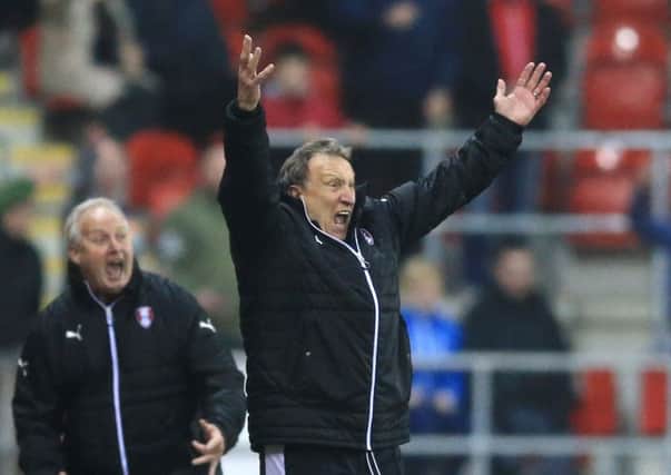 FIRE STILL BURNING: Rotherham United manager Neil Warnock, right, and assistant Kevin Blackwell show their emotions during the victory over Middlesbrough. Picture: Nigel French/PA.