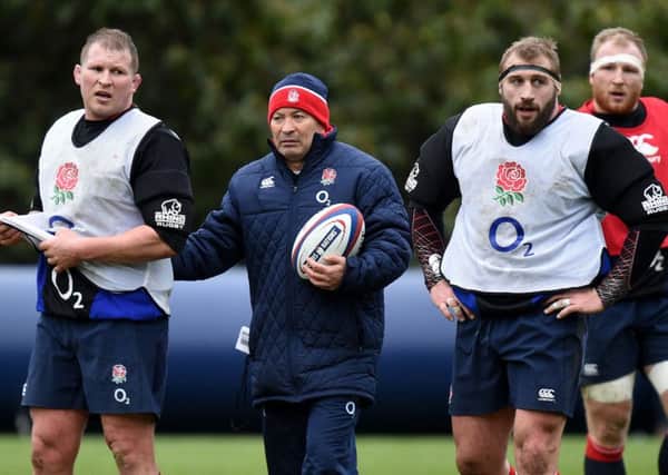 England head coach Eddie Jones (centre) with captain Dylan Hartley (left) and Joe Marler, during a Bagshot training session. Picture: PA.