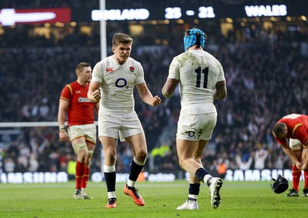 England's Owen Farrell celebrates victory with team-mate Jack Nowell (right).