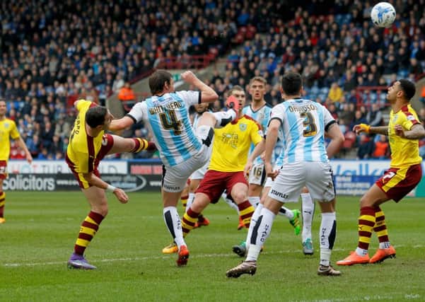 Burnley's Stephen Ward (left) scores his side's first goal of the game.