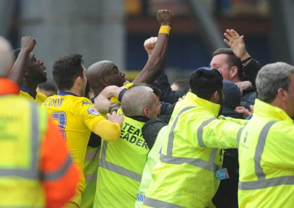 Souleymane Doukara celebrates with the Leeds fans after the 2nd goal. Picture by Simon Hulme