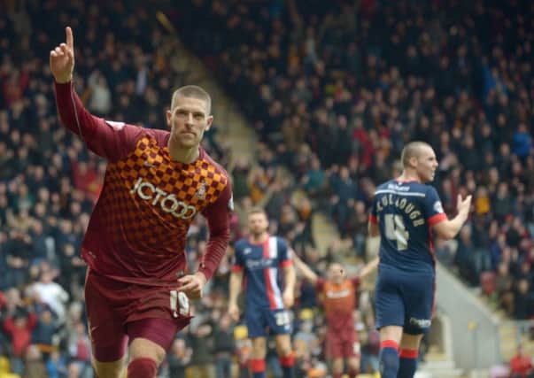 Jamie Proctor celebrates  scoring his second goal for  Bradford City against Doncaster Rovers .
