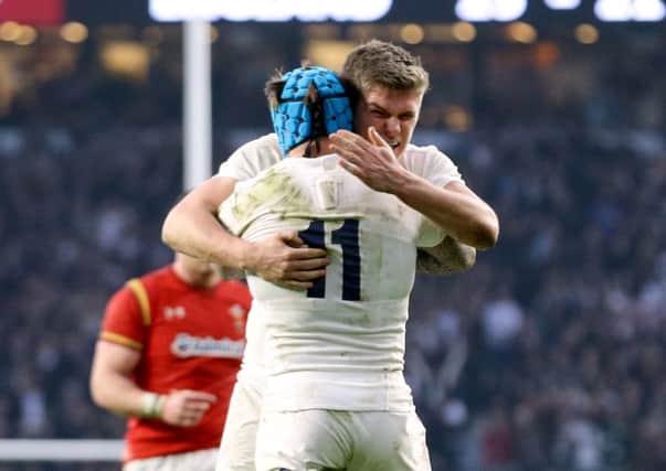 England's Owen Farrell celebrates victory with teammate Jack Nowell