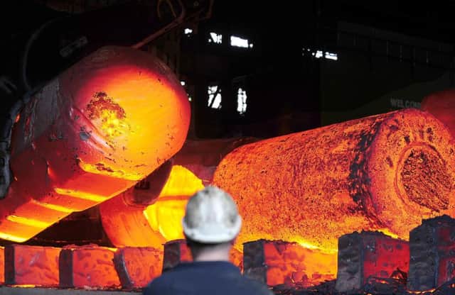 File photo of red hot metal being moved across the heavy forge at the Forgemasters Works in Sheffield   Photo: PA