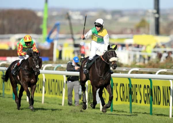 Jockey Leighton Aspell celebrates on board Many Clouds after victory in the Grand National at Aintree last year (Picture: Mike Egerton/PA Wire).