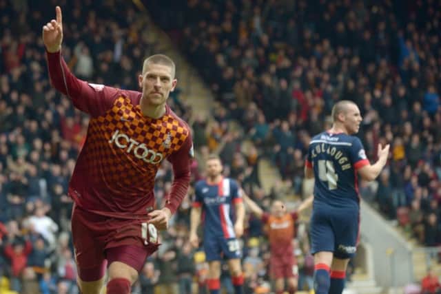 Bradford City's Jamie Proctor celebrates scoring against Yorkshire rivals Doncaster Rovers.
