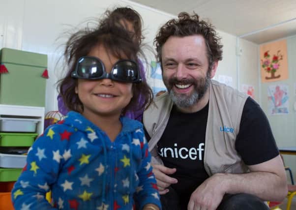 Unicef UK ambassador Michael Sheen meeting children in 1st- 3rd Grade Classes at a Unicef supported- primary school in Za'atari refugee camp in Jordant