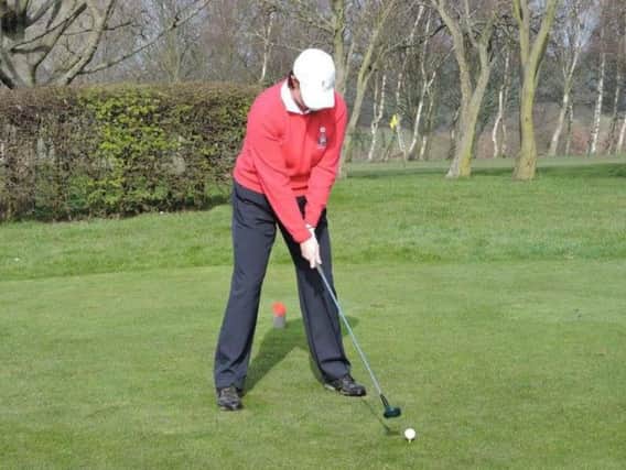 Becki O'Grady prepares to drive in as lady captain at Howley Hall GC with a persimmon-headed wood.