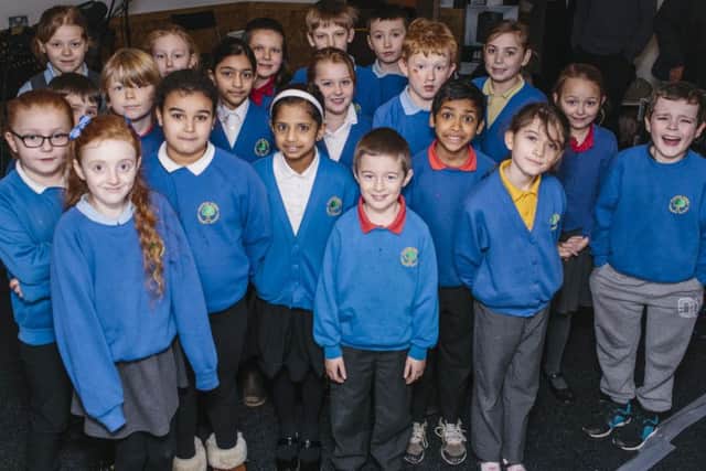 Youngsters from Clifton Green Primary School, who have seen their fundraising video for Sport Relief get responses from around the world, recorded a song at a professional recording studio.