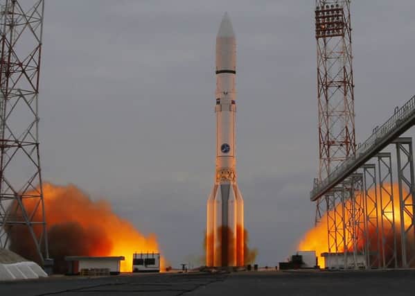 The Proton-M rocket booster blasts off at the Russian leased Baikonur cosmodrome, Kazakhstan,  (AP Photo/Dmitri Lovetsky)