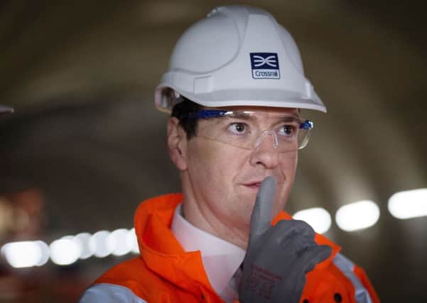 Chancellor George Osborne visits the Crossrail station construction site at Tottenham Court Road in central London ahead of the Budget.