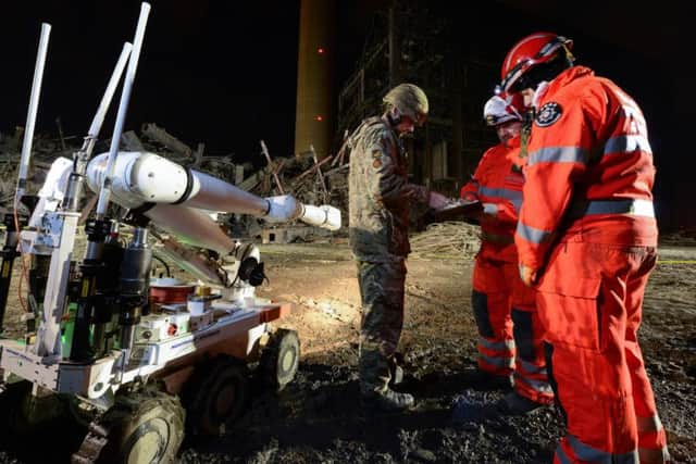 Photo taken by the Ministry of Defence, of a Cutlass remote controlled vehicle being used by search and rescue teams at Didcot Power Station, Oxfordshire, after a building collapsed at the power station. The collapse killed one worker and trapped three.