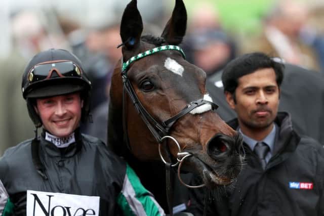 Jockey Nico de Boinville and Altior in the winners enclosure after victory in the Sky Bet Supreme Novices' Hurdle during Champion Day of the 2016 Cheltenham Festival at Cheltenham Racecourse.