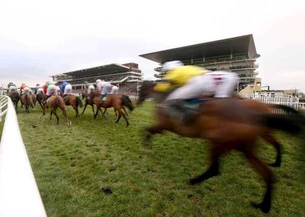Runners and riders compete for the 146th Year of the National Hunt Chase Challenge Cup during Champion Day of the 2016 Cheltenham Festival at Cheltenham Racecourse.