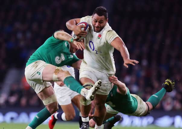 England's Billy Vunipola charges through the Ireland defence.