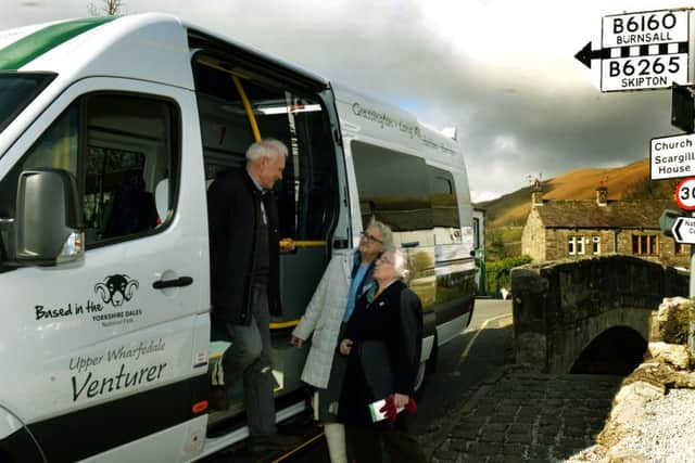 Alan Jones, one of five director of the  Upper Wharfedale Bus Company at Kettlewell with passengers  Muriel Raw (centre) and Mary Hurst.