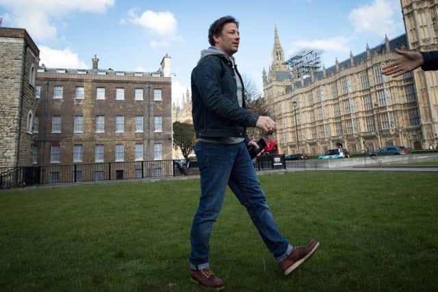 Jamie Oliver on College Green in Westminster, London, after he welcomed the announcement of a tax on sugary drinks