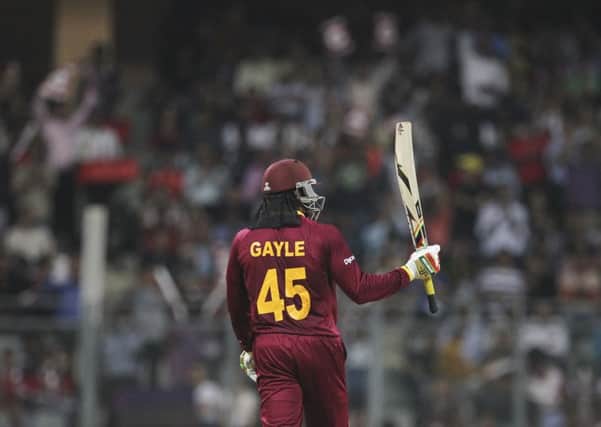West Indies Chris Gayle raises his bat