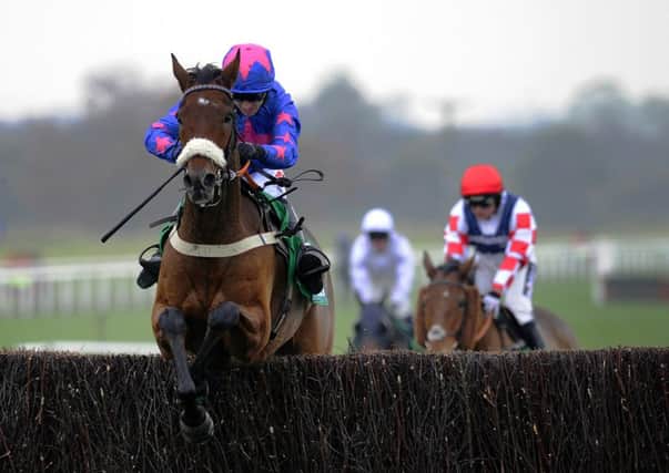 WETHERBY POINTER: Cue Card and Paddy Brennans victory in the Charlie Hall Chase at Wetherby put them on course for Cheltenham. Picture: PA.