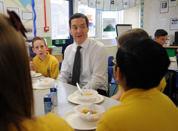 Chancellor George Osborne speaks to pupils at St Benedict's Catholic Primary School in Garforth, Leeds, on the day after he delivered his Budget Statement.  Picture by Simon Hulme