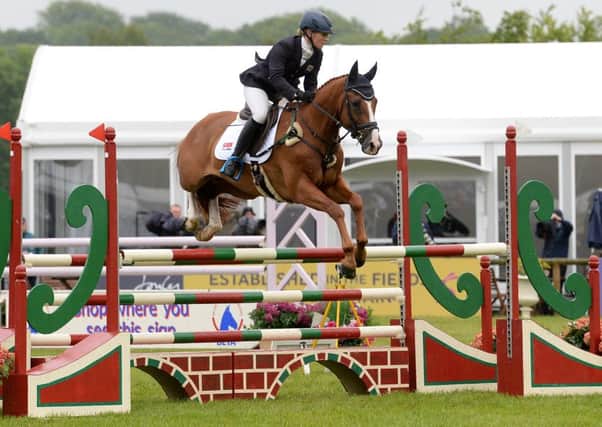 JUMP TO IT: Holly Woodhead and Dhi Lupison on the way to winning the CCI Under-25 event at Bramham. Picture by Anna Gowthorpe.