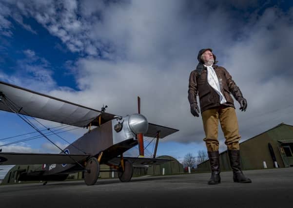 Date:15th March 2016. Picture James Hardisty.
The Yorkshire Air Museum, at Elvington, York, have opened a new exhibition 'Gas Bags To Super Zeppelins. Pictured Brian Watmough, next to a Eastchurch Kitten WWI bi-pane, designed as a 'Zeppelin killer'.