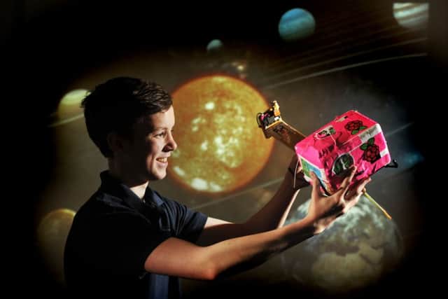 Sam Stead, 15, at Rishworth School with the payload a team of pupils sent   into space as part of a science project named Towards Infinity. Picture Tony Johnson