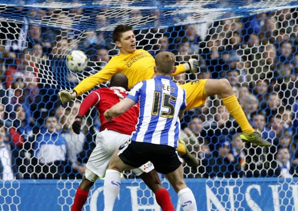 Wednesday's Tom Lees heads first goal.