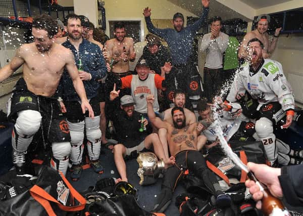CHAMPIONS! Sheffield Steelers' players celebrate winning the Elite League regular season title on Sunday night. Picture: Dean Woolley.