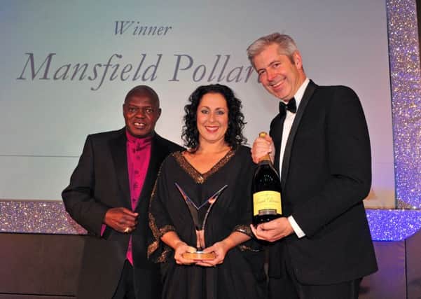 Joanna Robinson of Mansfield Pollard recieves the Employer of the Year award from Archbishop Dr John Sentamu and Justin Webb at the Yorkshire Post Excellence in Business awards at The Queens Hotel  in Leeds. Picture Tony Johnson