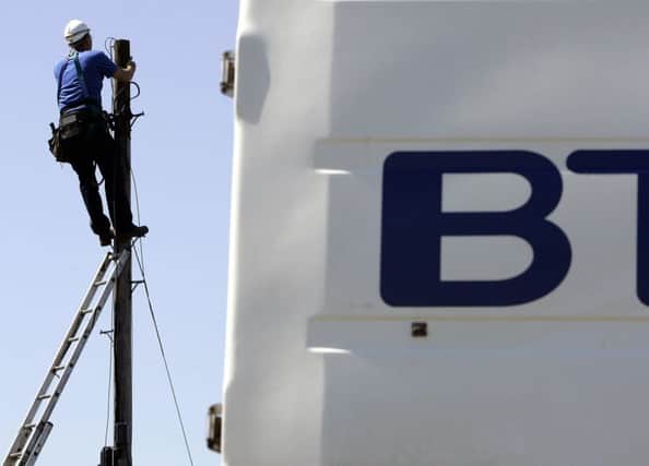 A file photo of a BT worker up a telegraph pole Photo: Andrew Milligan/PA Wire