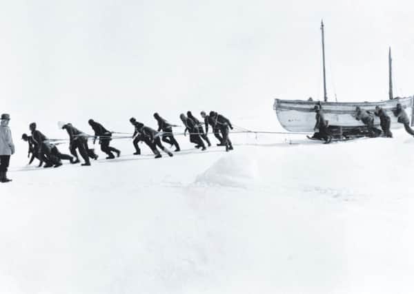 The James Caird being hauled across the ice.