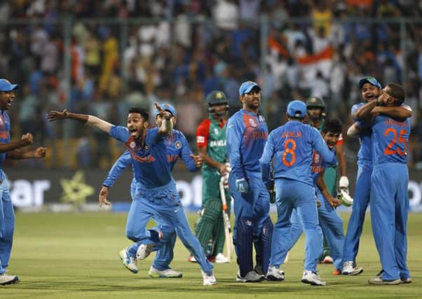 Indian cricketers celebrate after winning against Bangladesh in Bangalore. Picture: AP/Aijaz Rahi.