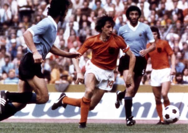 Johan Cruyff, pictured playing for Holland during the 1974 World Cup. The Dutch great died aged 68 today after a battle with cancer.