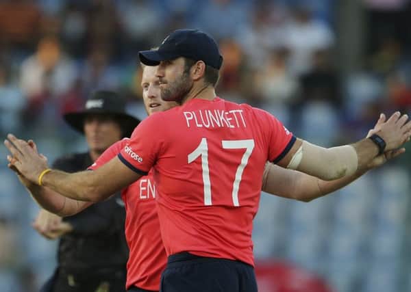 England's Liam Plunkett, right, and Ben Stokes celebrate the fall of an Afghanistan wicket (Picture: Manish Swarup/AP).