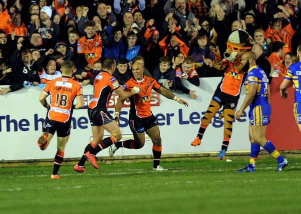 Castleford Tigers ' Jake Webster celebrates his try against Leeds Rhinos on Thursday night.
 Picture: Jonathan Gawthorpe.