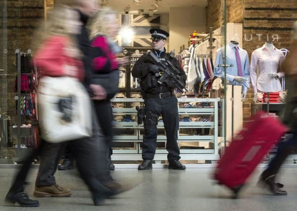 Armed police close to the Eurostar terminal in St Pancras International station, London, in the wake of co-ordinated bomb attacks on the main airport and the Metro system in Brussels, Belgium.