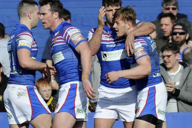 Tom Johnstone celebrates his first try for Wakefield Trinity Wildcats. (Picture: Bruce Rollinson)