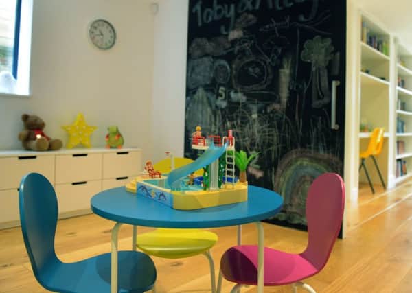 The playroom at the rear of the basement with sliding blackboard wall