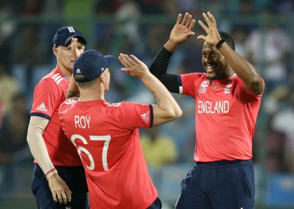 England's Chris Jordan, right, celebrates with teammate Jason Roy after dismissing Sri Lanka's Dinesh Chandimal (AP Photo /Tsering Topgyal)