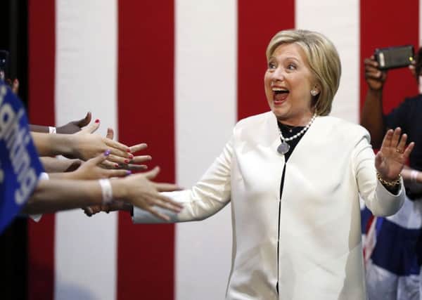 Democratic presidential candidate Hillary Clinton reacts to supporters following the latest round of primaries.