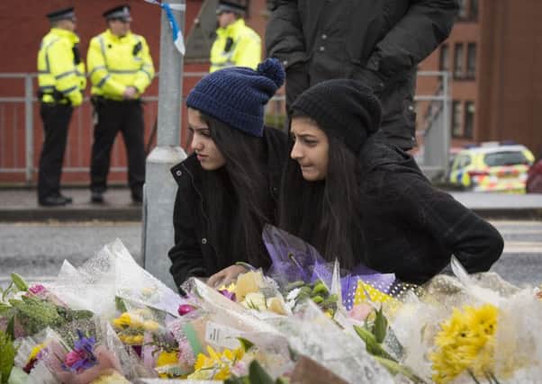 A vigil has been held in Glasgow for the well-respected Muslim shopkeeper who was killed in what police are treating as a "religiously prejudiced" attack.
