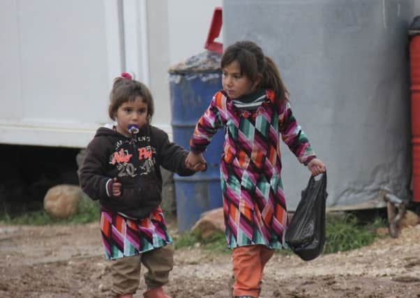 Displaced Iraqis and Syrian refugees in the north of the country.