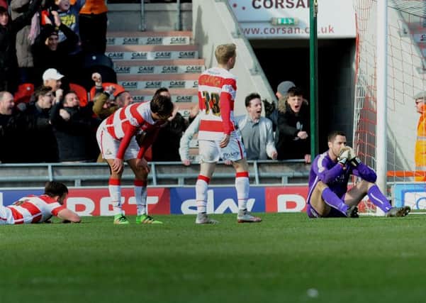 Doncaster Rovers' players show their dismay after the late goal by Blackpool. Picture: Simon Hulme.