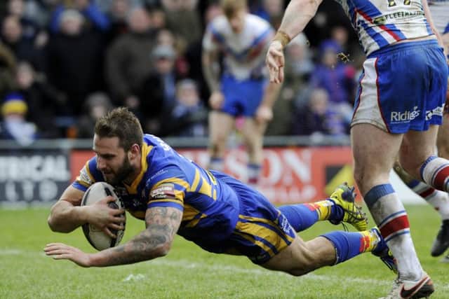 Mitch Achurch scores the Rhinos' third try - but it wasn't enough as Wakefield hit back to win at Headingley.  Picture: Bruce Rollinson.