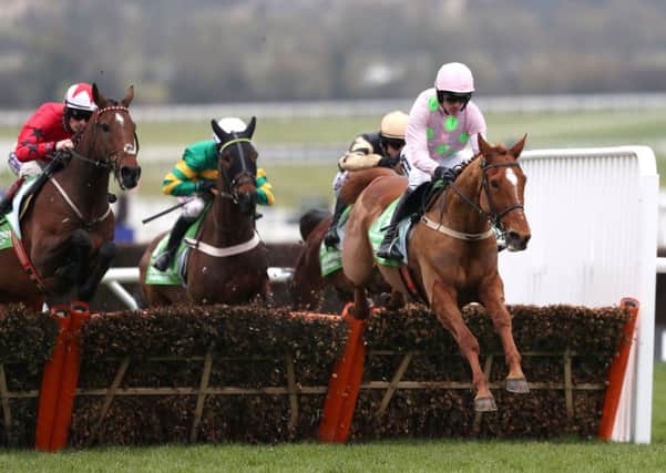 TOP TWO: Annie Power going on to win the Champion Hurdle with My Tent Or Yours, centre, challenging.