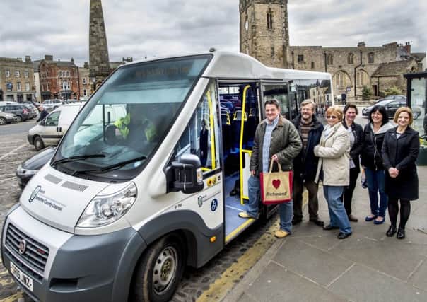 County councillor Stuart Parsons, left, and County Council public transport officer Dianne Pottage, with users of the new service.