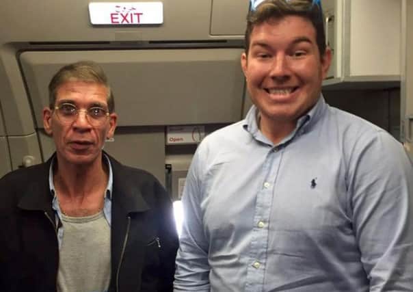 Ben Innes poses with Seif Eldin Mustafa on board the plane. (Ben Innes/Twitter).