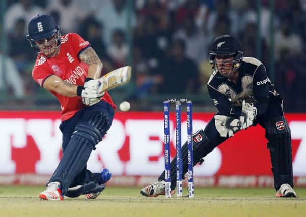 England's Jason Roy, left, on his way to a match-winning innings of 78 against New Zealand in delhi earlier today. Picture: AP/Tsering Topgyal.