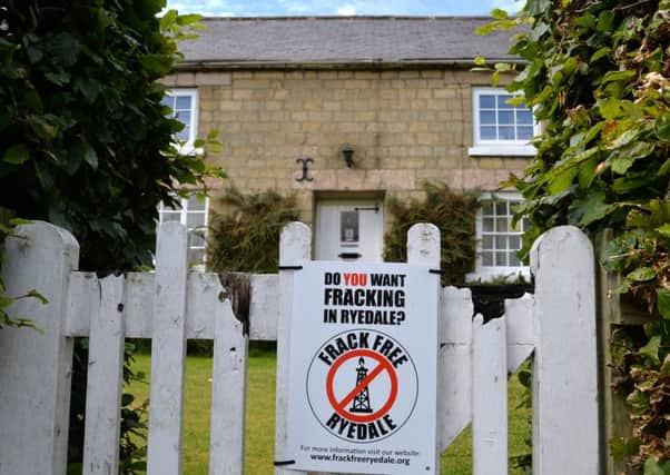 An anti-fracking poster on the garden gate of a house in Kirby Misperton. Picture: Anna Gowthorpe